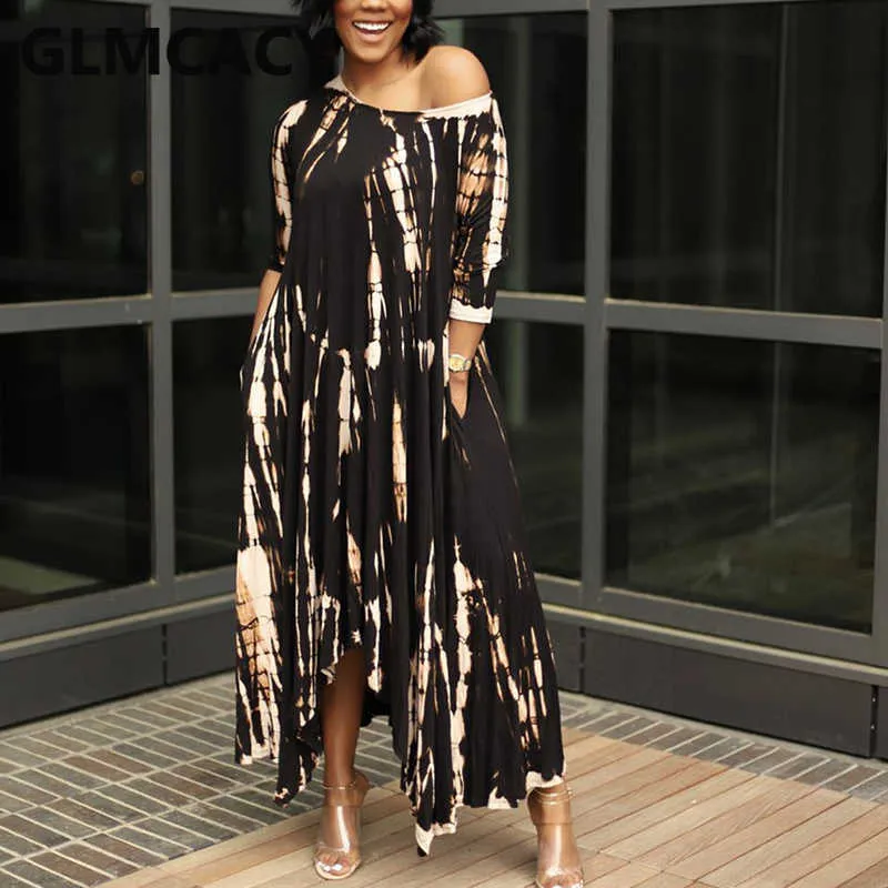 Blue maxi dress with White abstract patterns, loose flowing silhouette, halter neckline, long wide sleeves, lightweight material suitable for warm