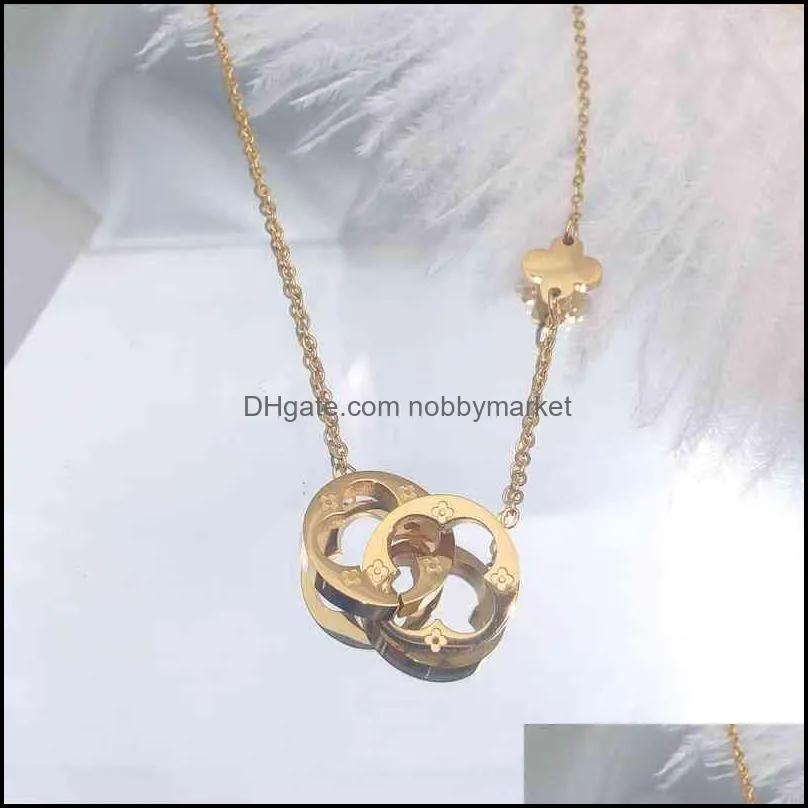 Korean double ring hollow out Clover Necklace female titanium steel 18K Gold simple buckle lucky grass clavicle chain neck