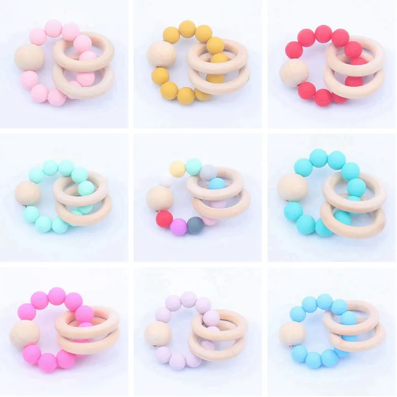 Baby Trä Teethers Infant Silicone Chew Nursing Bracelets Baby Rattle Barnvagn Tillbehör Nyfödda Tandring Ring Toys 16 färger BT5975