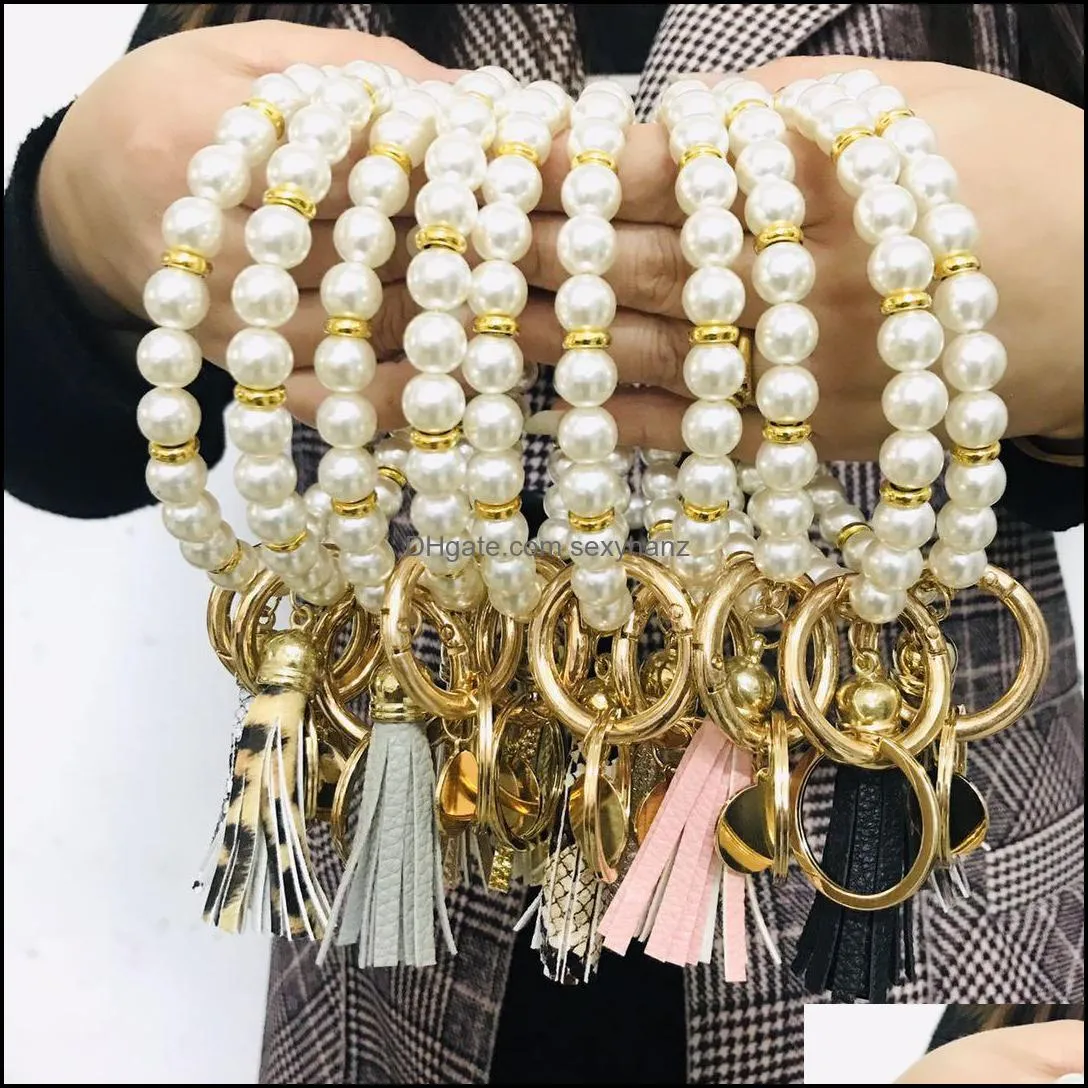 Best Seller Elegant Personalized Metal Disc Charm Pearl Bangle Keyring Handmade Fashionable Faux Pearl Leather Tassel Bracelet