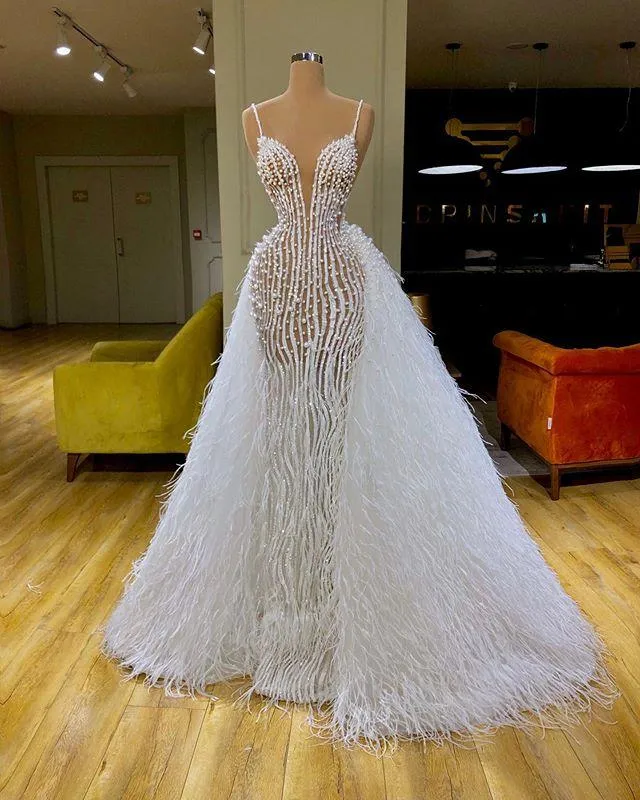 Luxury Pearls Arabic Mermaid Wedding Dresses Bridal Gowns With Detachable  Train Sexy Spaghetti Neck Feather Robe De Marie From Lindaxu90, $471.56 |  DHgate.Com