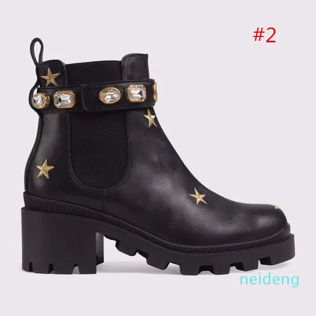 Embroidered leather ankle boot with belt 2025