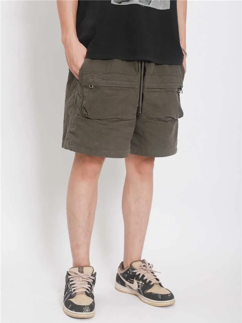 メンズショートパンツの自己製の軍用布マルチポケット洗浄古い巾着ゴムバンド弾性ジッパーハイストリートトレンド緩い戦術的なショーツ男性