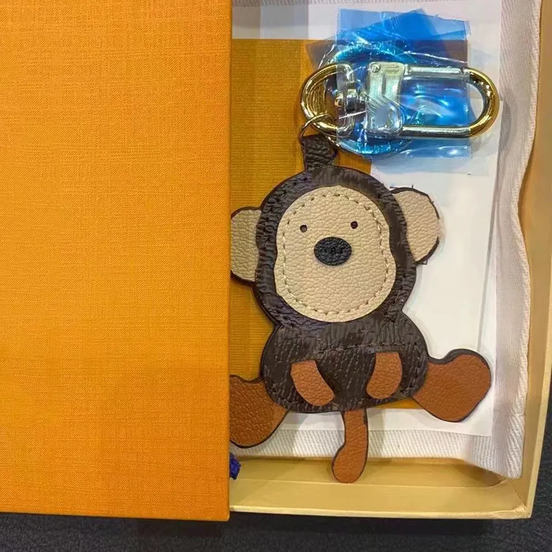 Lejon tiger apa björn nyckelringar lyxig designer läder nyckelkedja laser präglad väska hängen med låda 1853 bra
