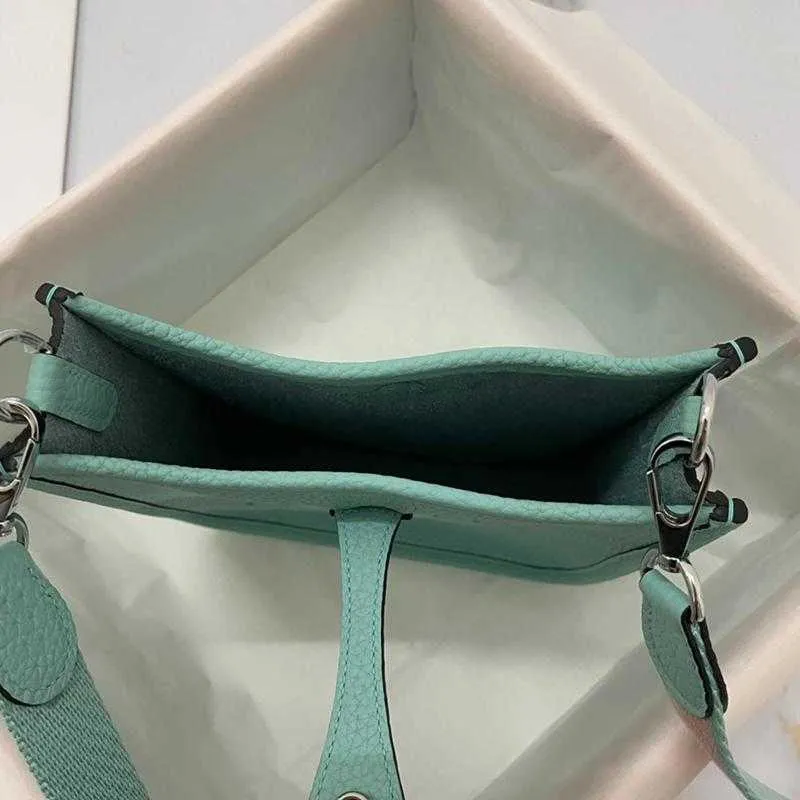 Summer European and American original first layer bag fashion personality design shoulder messenger hollow bucket female tide 2021