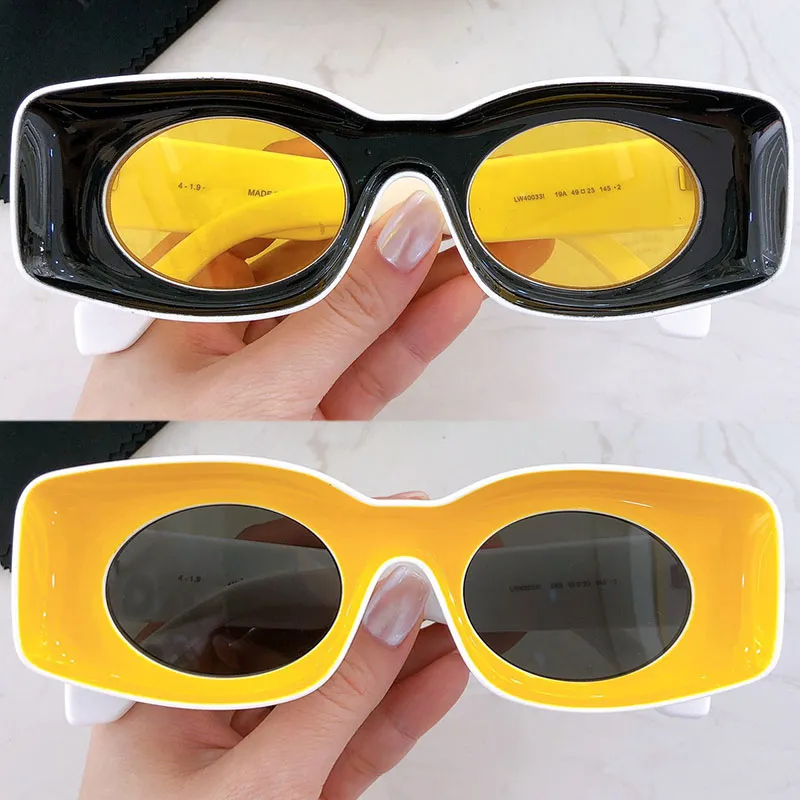 Designer solglasögon lw400331 kvinnors mode personlighet oval lins syster par strand semester fest platta glasögon UV400 skydd med originallåda