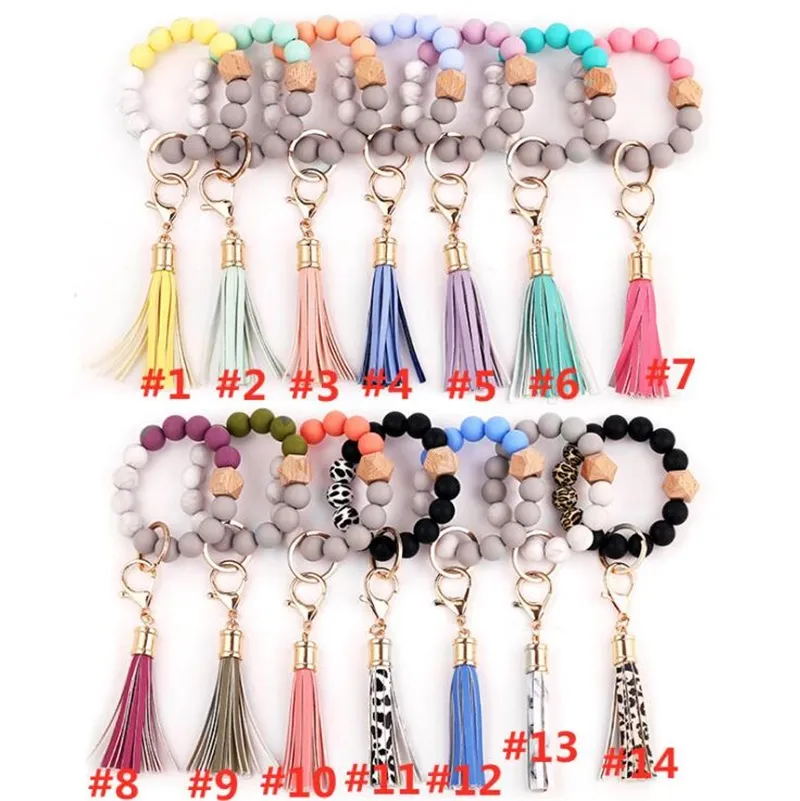 LLavero de pulsera, llavero de coche, brazalete de silicona y cuentas de madera, llavero, pulsera, borla de cuero para mujeres y niñas, colgante de bolsos