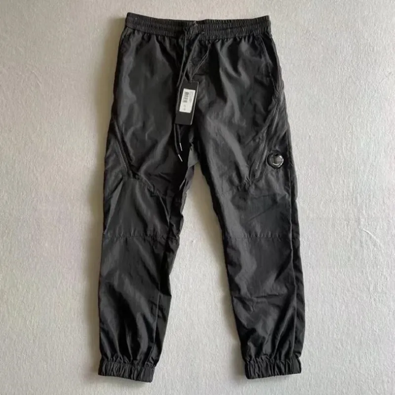 Calça de nylon de metal calça um logotipo de lente zíper de bolso de bolso machos de calça de calça casual de calça casual machos m-xxl