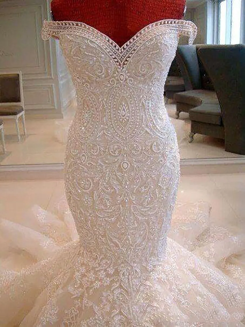 2022 Fantastisk spets sjöjungfru bröllopsklänningar från axeln Sweep Train Appliques Dubai arabiska stil Brudklänningar skräddarsydda