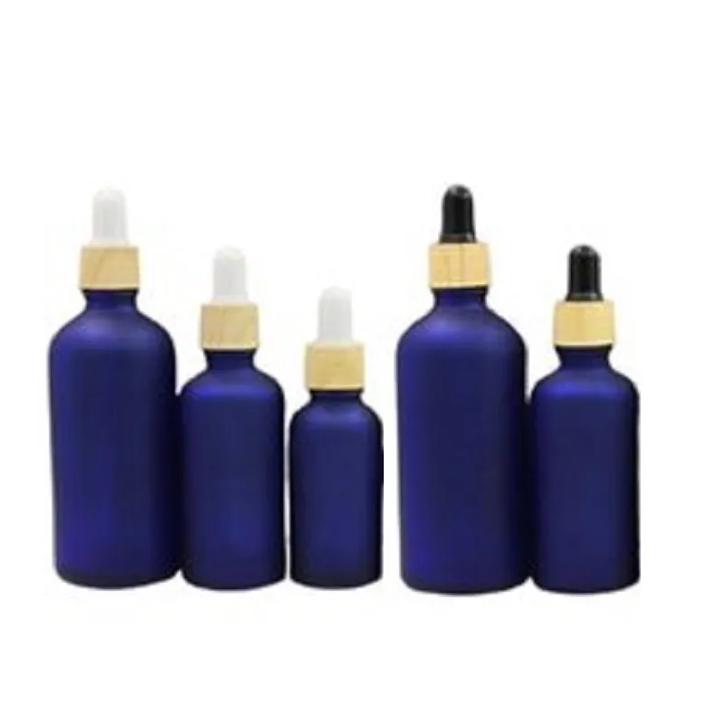 Opakowania Butelka Refillable Butelka Fałszywa Drewna Pokrywa Guma Kroplówki Pusta Frost Blue Glass Essence Essencja Fiolki Olejowe 5ml 10ml 15 ml 30 ml 50 ml 100 ml