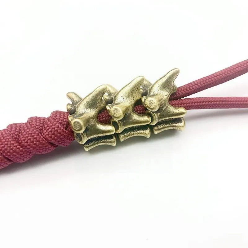 Utomhus Gadgets Brass Spine Ben Kniv Hängsmycke Personlighet Kedja Cord Ring Bil Ren Pärla Tillbehör Paraply DIY C S8W5