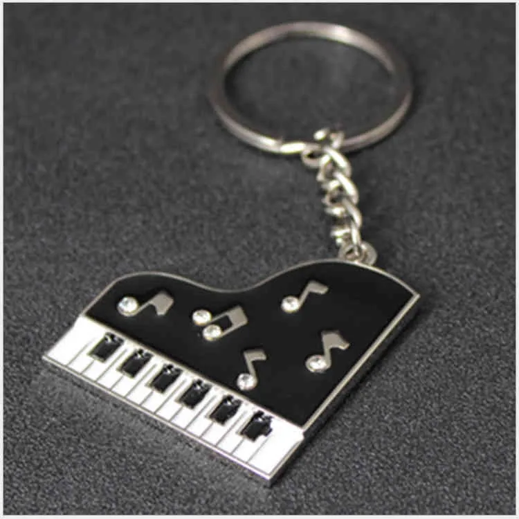 Portachiavi Anello regalo creativo in metallo con chiave di pianoforte a fila singola personalizzato ciondolo maschile e femminile