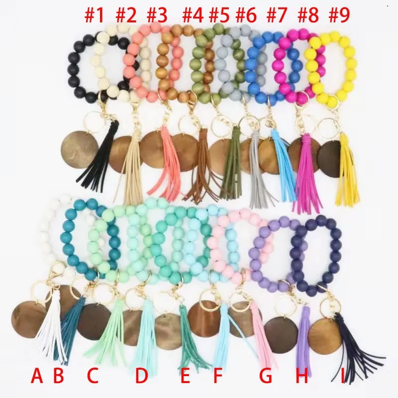 Moda Pulseras de cuentas de madera Borla de haya Llavero Colgante de fiesta Pulsera de cuero Llavero de mujer Llaveros de mujer Disco de muñeca de madera Anillos de cuentas