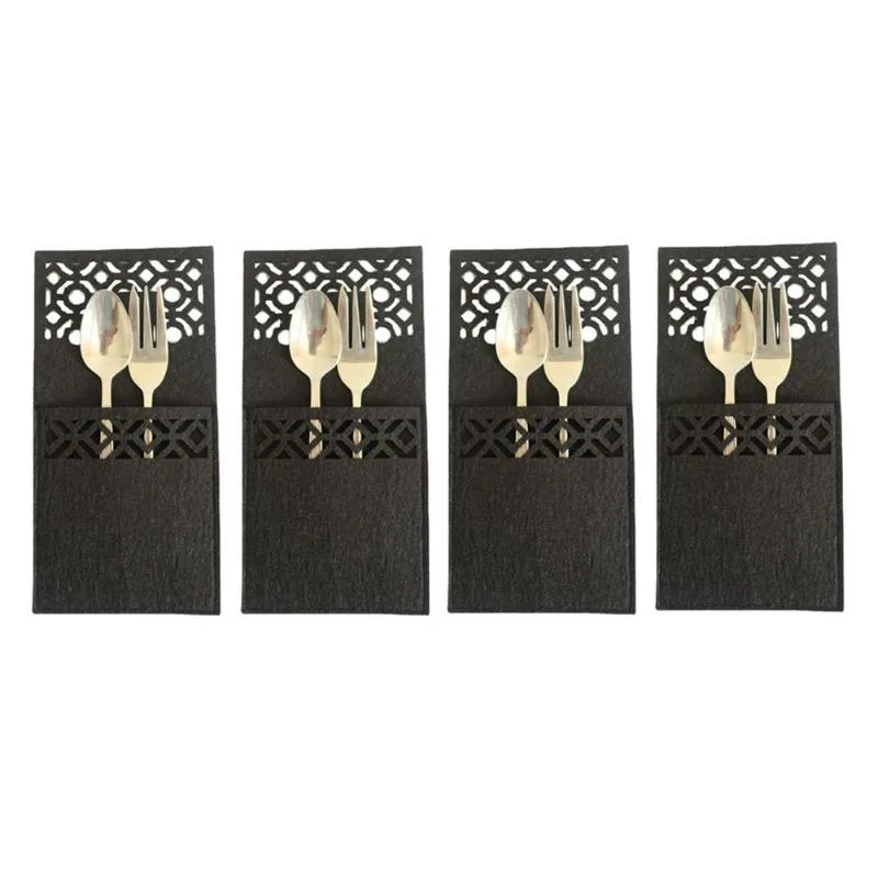 Tapis Pads 4PCS / Set Couteau de Noël Fourchette Couverts Sac Mignon Motif Creux Rectangulaire Porte-Vaisselle Décorations de Fête de Noël Année