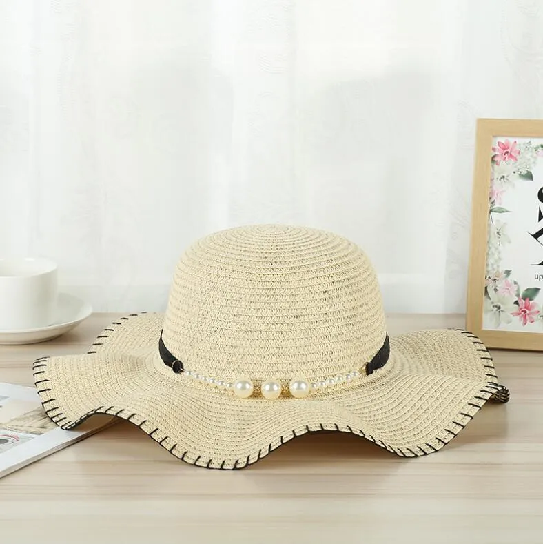 Le signore estive di moda escono cappelli da sole Temperamento cappello di paglia intrecciato perlato cappelli da viaggio all'aperto Cappelli a tesa larga