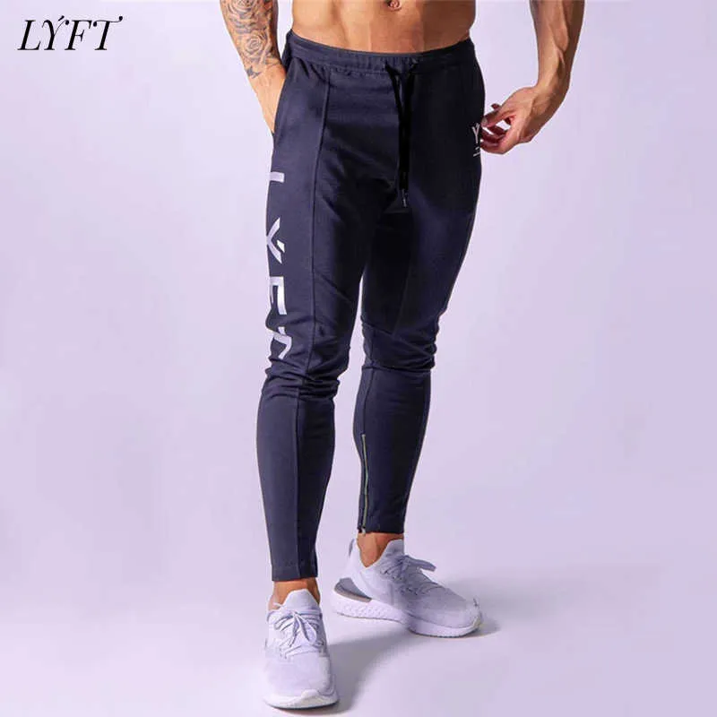 LYFT nuevos pantalones deportivos casuales para hombres pantalones de color sólido para hombres jóvenes populares pantalones de cintura suelta X0615