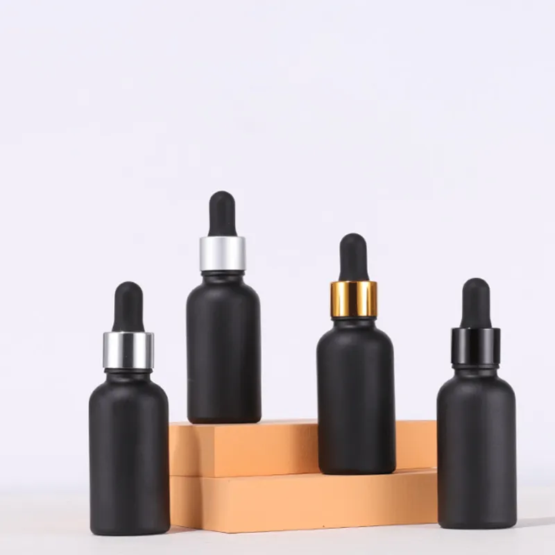 Nieuwste matte zwarte glazen druppelaar flessen 30ml etherische olie cosmetische containers met bamboe zilver gouden caps