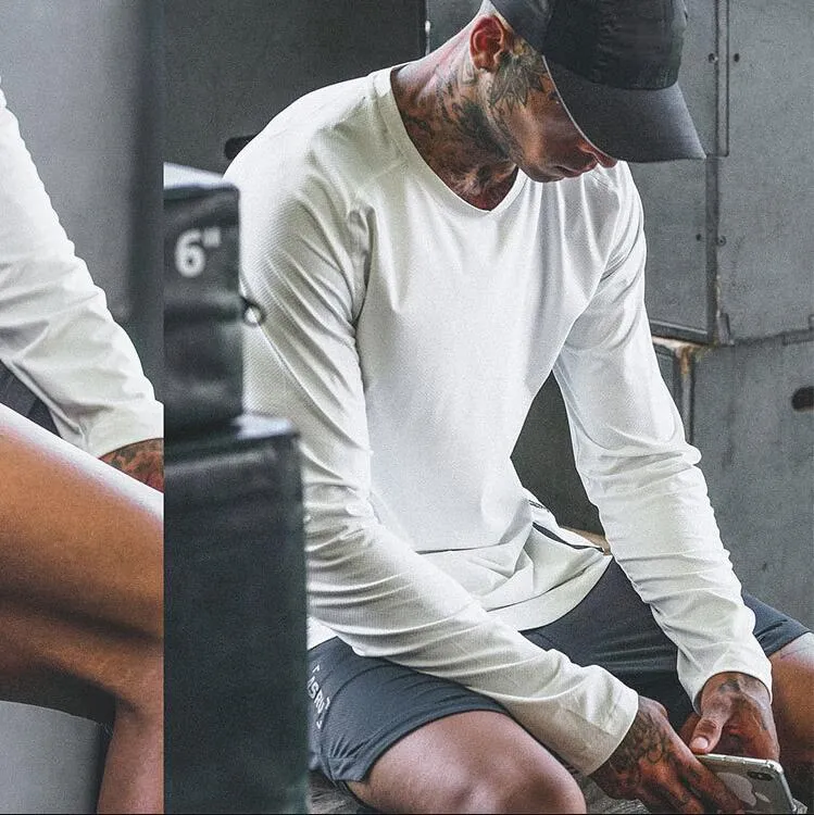 T-shirt da uomo estive larghe in tinta unita ad asciugatura rapida camicia a maniche lunghe da allenamento per il fitness
