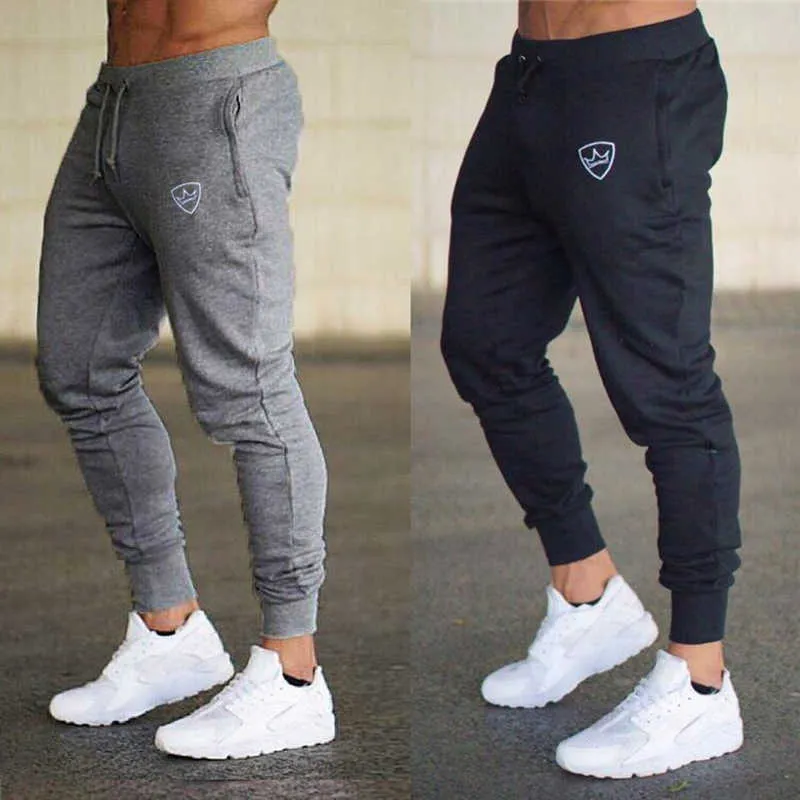 Mäns kvalitetsmärke män byxor fitness casual elastiska byxor bodybuilding kläder casual gym träning sweatpants joggare byxor y0927