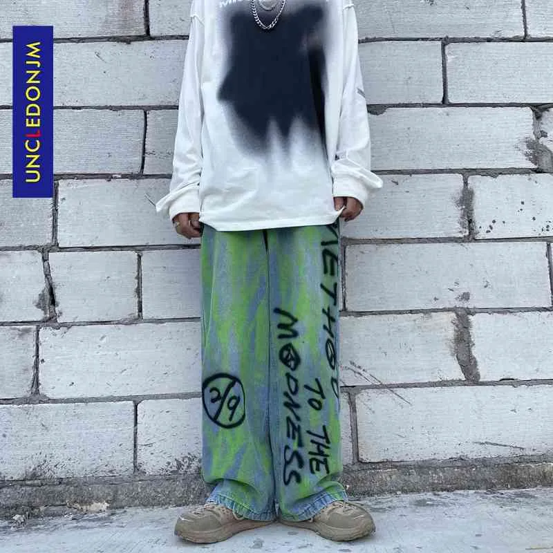 Uncledonj Graffitiの手紙ジーンズの男性が苦しんでいるデニムジーンズ韓国のファッション服デザイナーのヒップホップUM2006-6