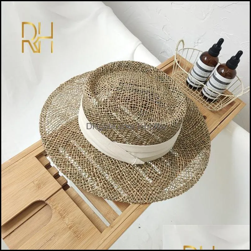 Travel Natural seagrass hollow flat brim hat ladies summer porkpie concave round sun hat beach straw hat with ribbon wholesale Y0910