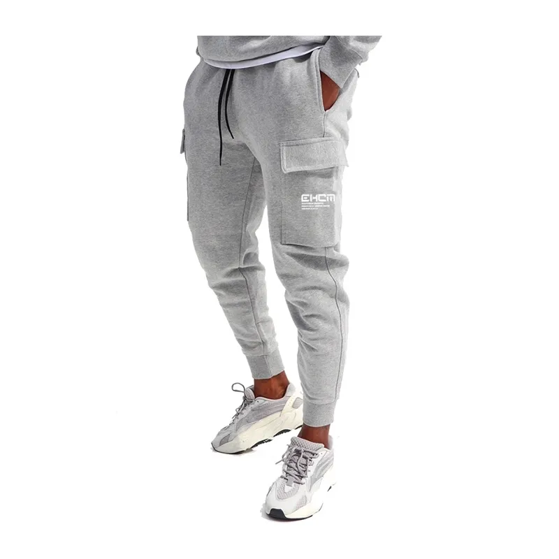 رياضة الرجال السراويل القطن جيوب متعددة عارضة البضائع sweatpants الرجال العلامة التجارية رسالة طباعة ركض اللياقة السراويل زائد الحجم 3xl 210406