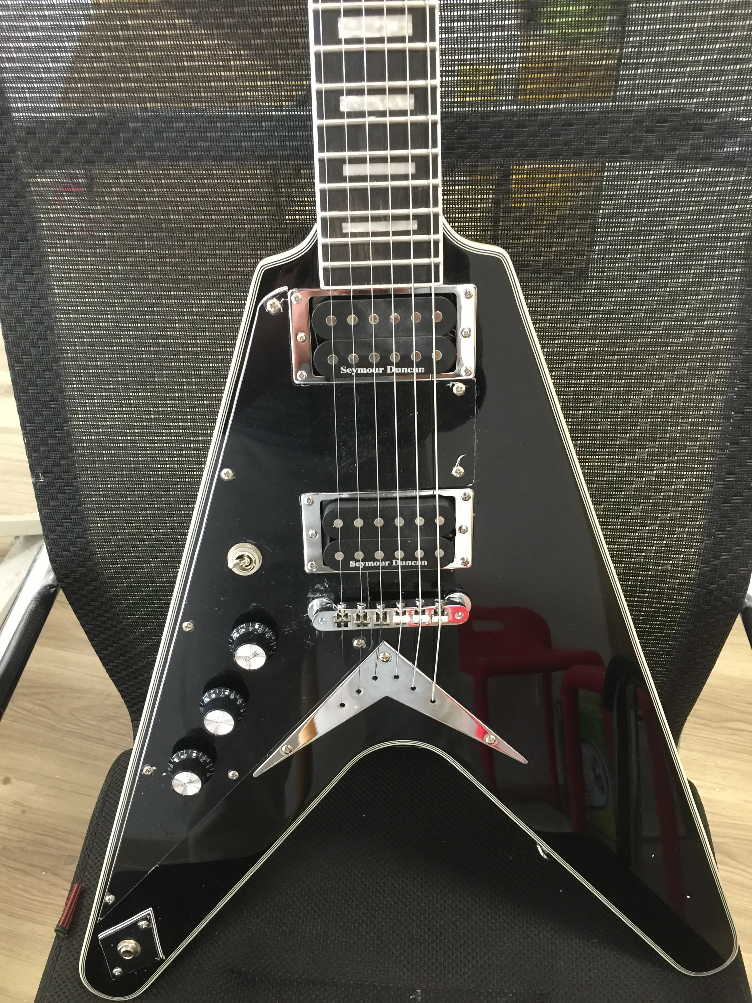 left handed V shape electric guitar with ebony fretboard black custom lefty electric-guitar backhand guitarra
