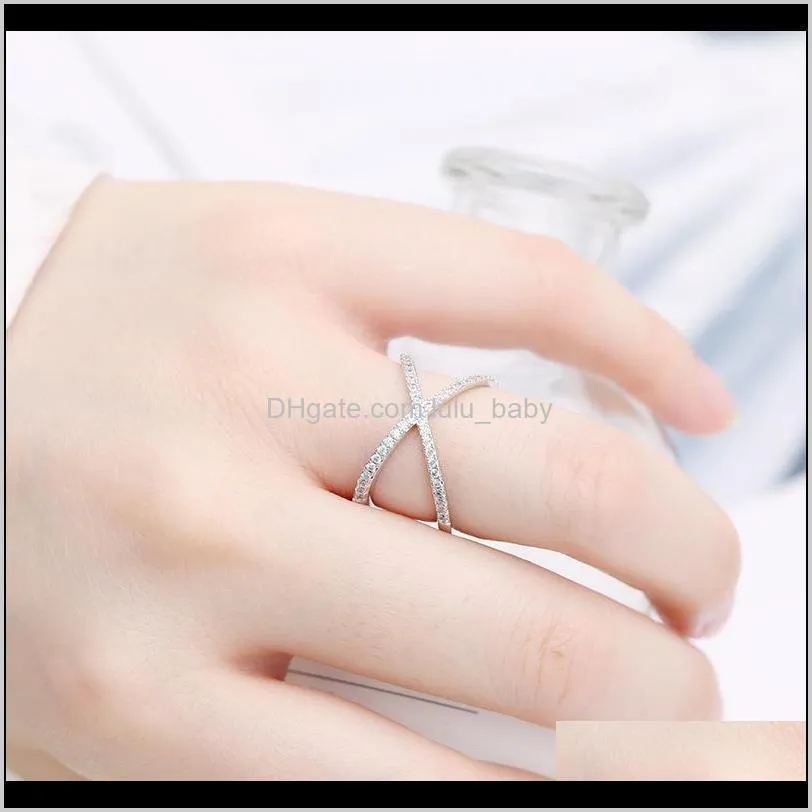 Band Ringar Drop Leverans 2021 Europeisk Minimalistisk stil Micro-Inlaid Zircon Cross-Line Hollow Lucky Ring Smycken Temperament Kvinnor Märke Luxu