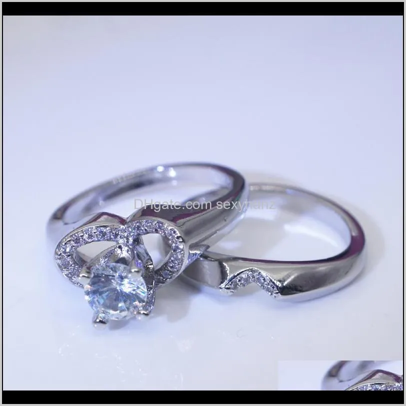 Band Ringar Smycken Drop Leverans 2021 Ett par kreativa hjärtformade simulering diamant kvinnliga europeiska och amerikanska mode par engageme