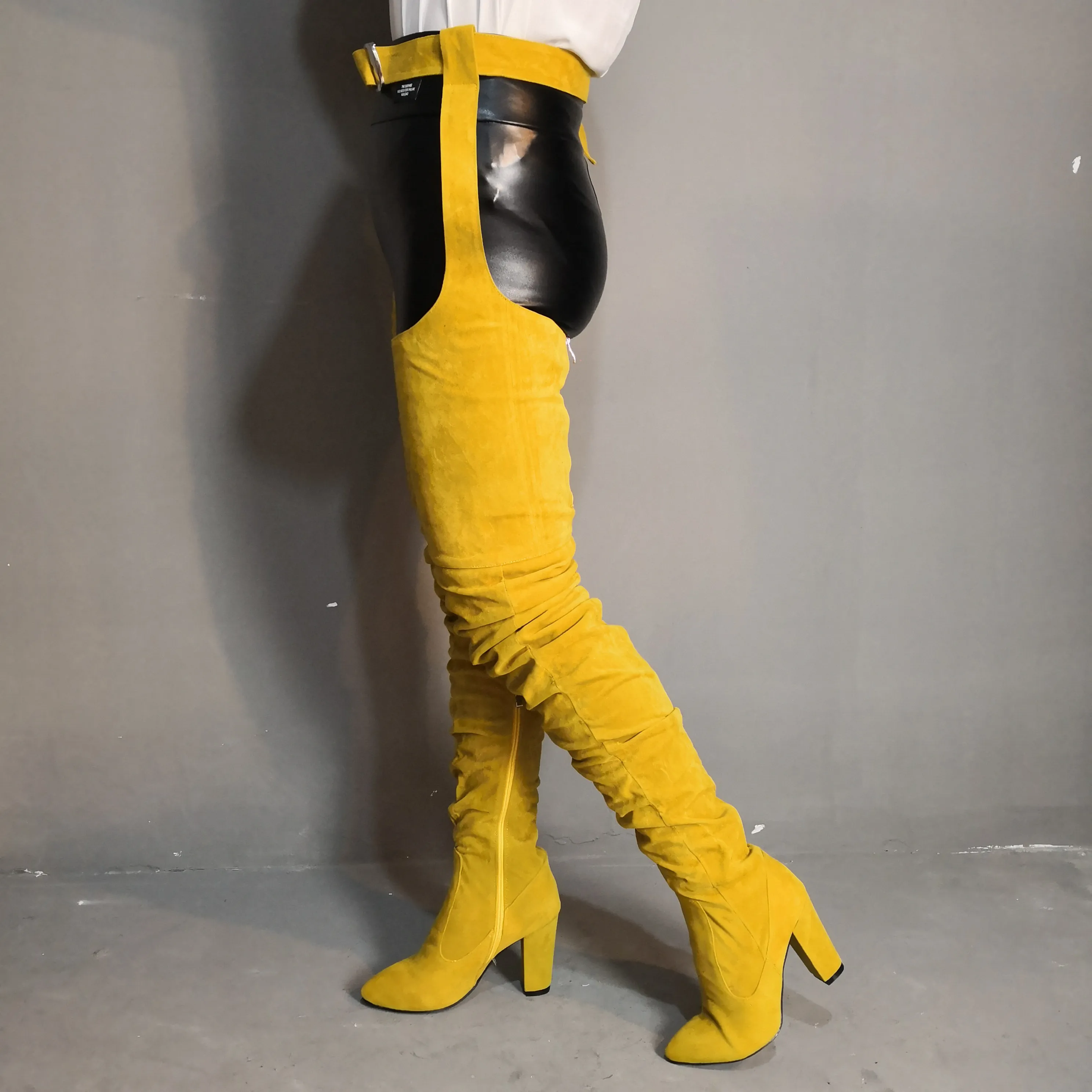 Thigh high boots with belt strap clearance