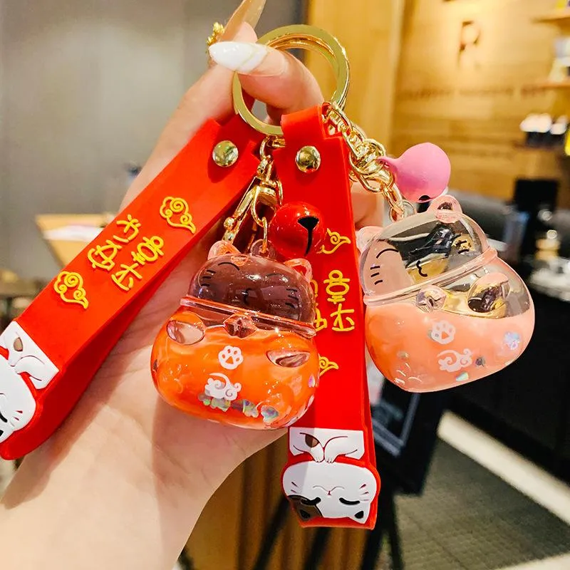 Keychains Cute Maneki Neko Lucky Cat Liquid Crystal Quicksand Rubber Wristband Anime Keychain Key Chain For Women Bag Pendent Charms D770