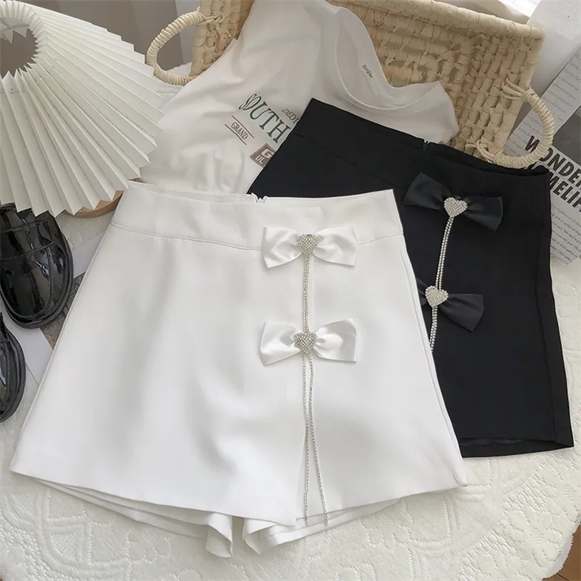 Shorts kjolar kvinnor vit svart diamant båge a-line all-match sashes sommarknapp 220427