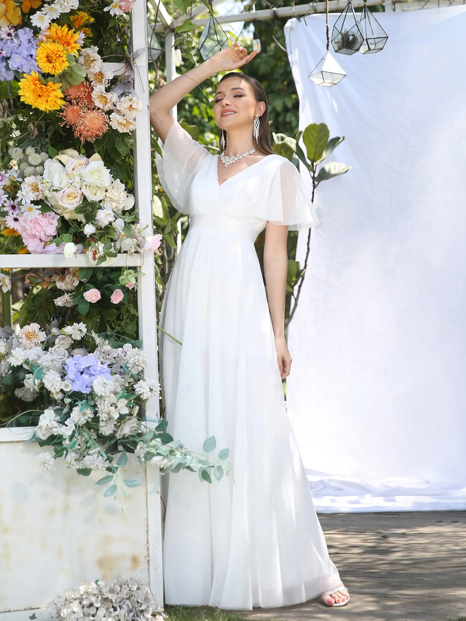 Elegant Beige V-Neck Tulle A-Line Beach Wedding bohemian Wedding dress with Flare Short Sleeves, Ribbon Belt, and Ruched Detailing - Floor Length