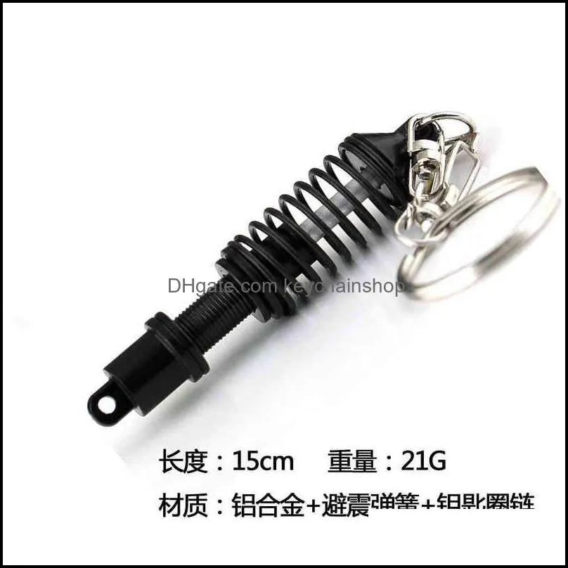 personality creative punk style car shock absorber keychains hot sell stainless steel gun black key chains for brave men 2022