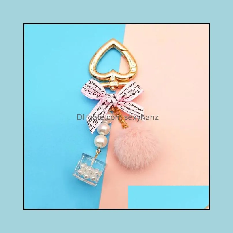 fashion pearl chain crystal bottle bow pompom keychain for women handbag key chain ring car fluffy puff ball keychains jewelry