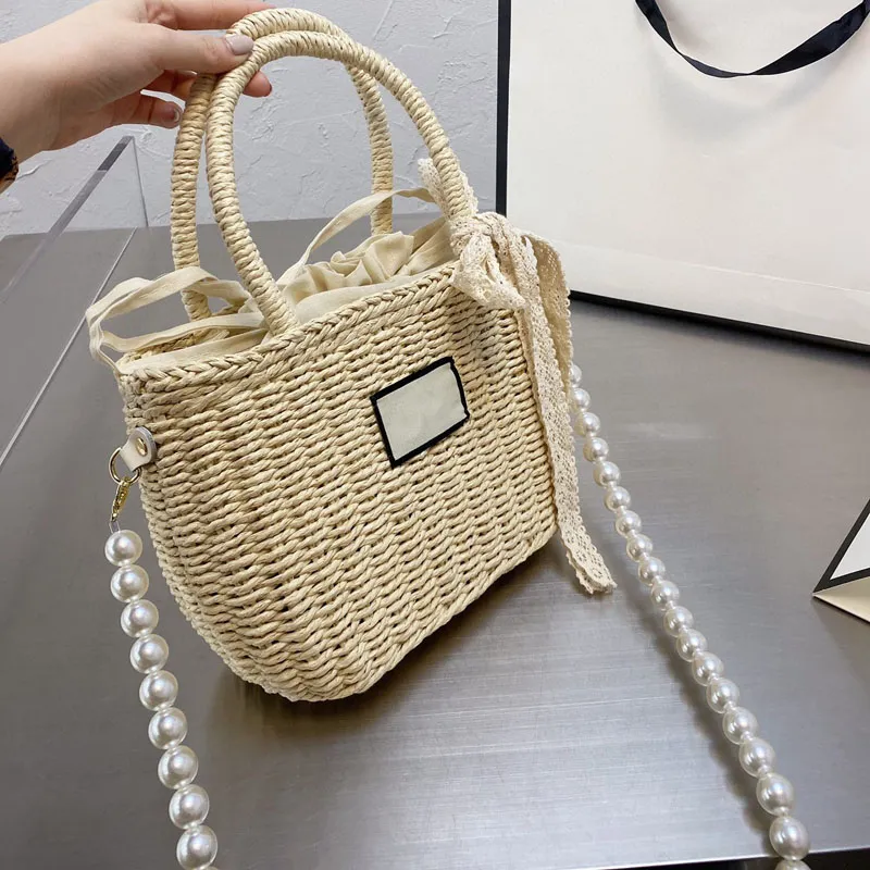 Bolsos de diseñador para damas 2022 Bolso de paja de moda Bolso de hombro de gran capacidad Simple Versátil Pearl Tote Mochila tamaño 22 * 19