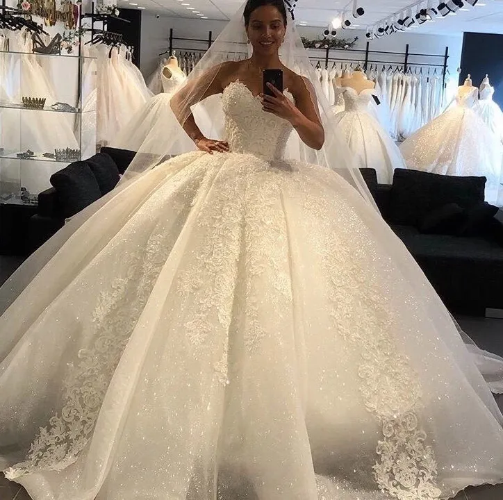 2023 Cristalli di lusso di design Abiti da ballo lunghi Abiti da sposa Strass Lace-up Indietro Abito da sposa arabo Collo trasparente Vestidos De Novia