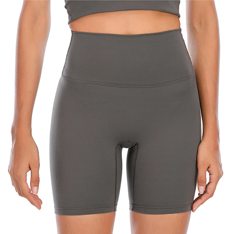 Йога Женская сплошное цвет короткие обнаженные бедра с жесткими эластичными тренировочными штанами.