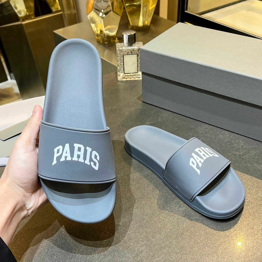Heren Damesslippers Sandalen Muiltjes Zomer Zwembad Glijbaan Klassieke rubberen pantoffel Top Luxe Mode Parijs 3D reli flogo Dames Strand Platte