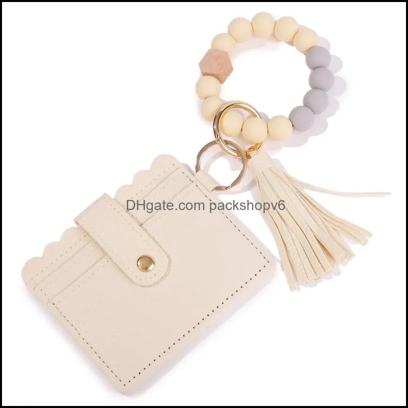 Silica gel bracelet chain key ring cross-border Amazon new PU tassel card bag silicone bracelet bracelet key ring wholesale ladies