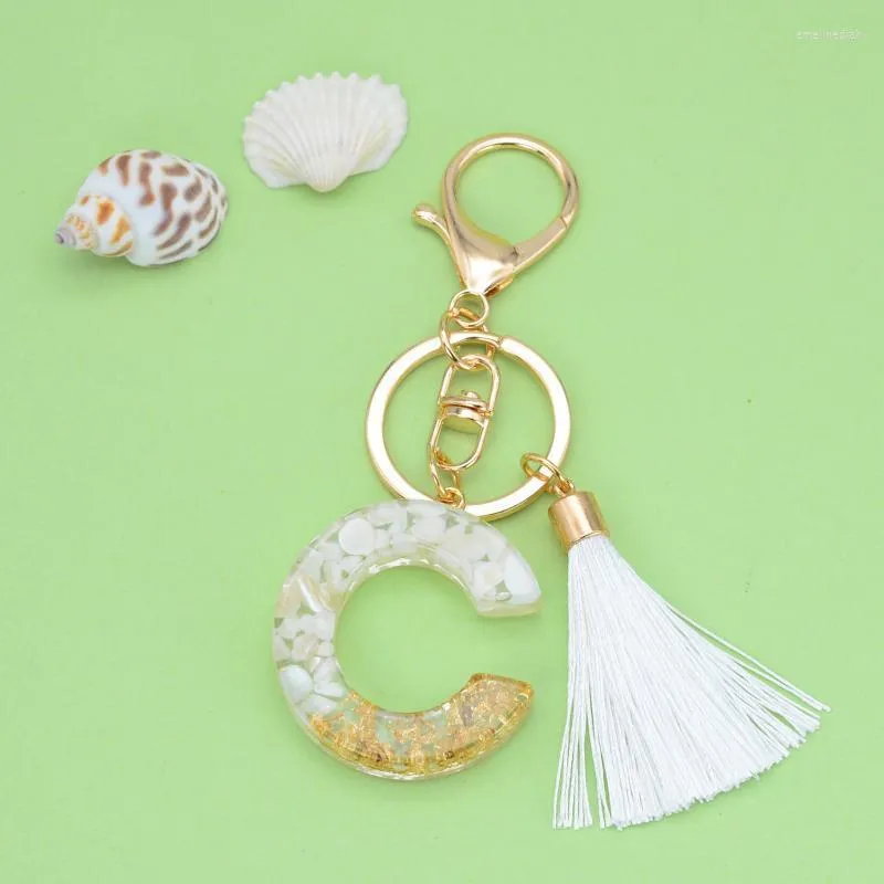 Keychains Style White Tassel Letter Keychain Gold Foil Crystal Glue Fashion 26 English Pendant Charms Small Gift For Couple Emel22