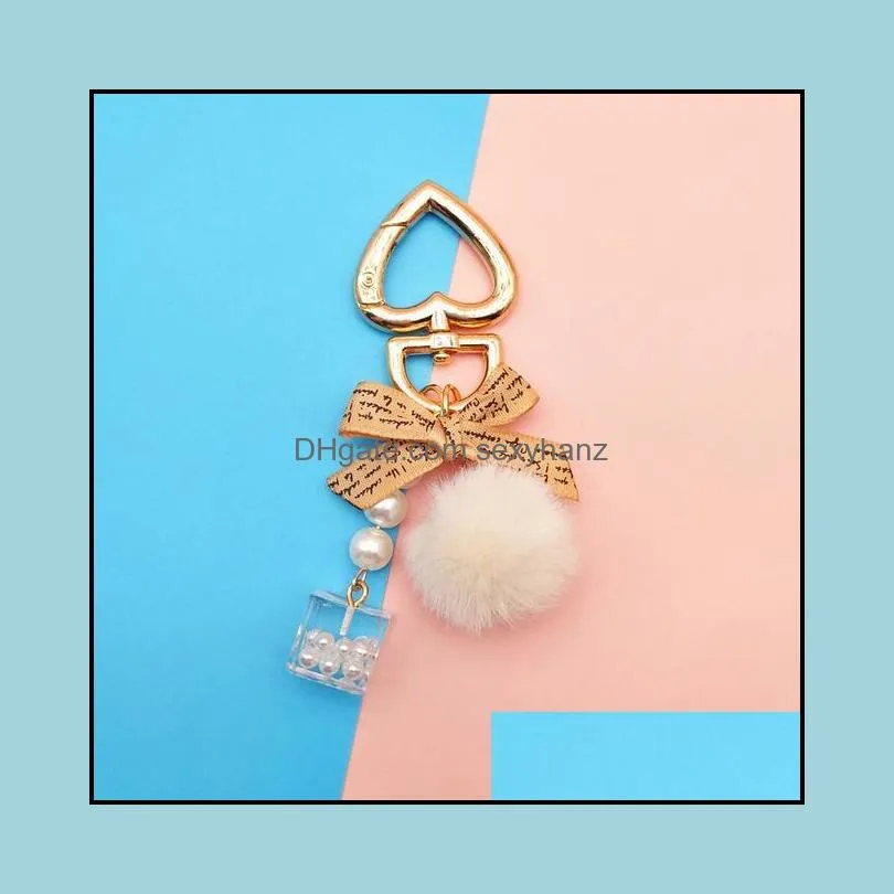 fashion pearl chain crystal bottle bow pompom keychain for women handbag key chain ring car fluffy puff ball keychains jewelry