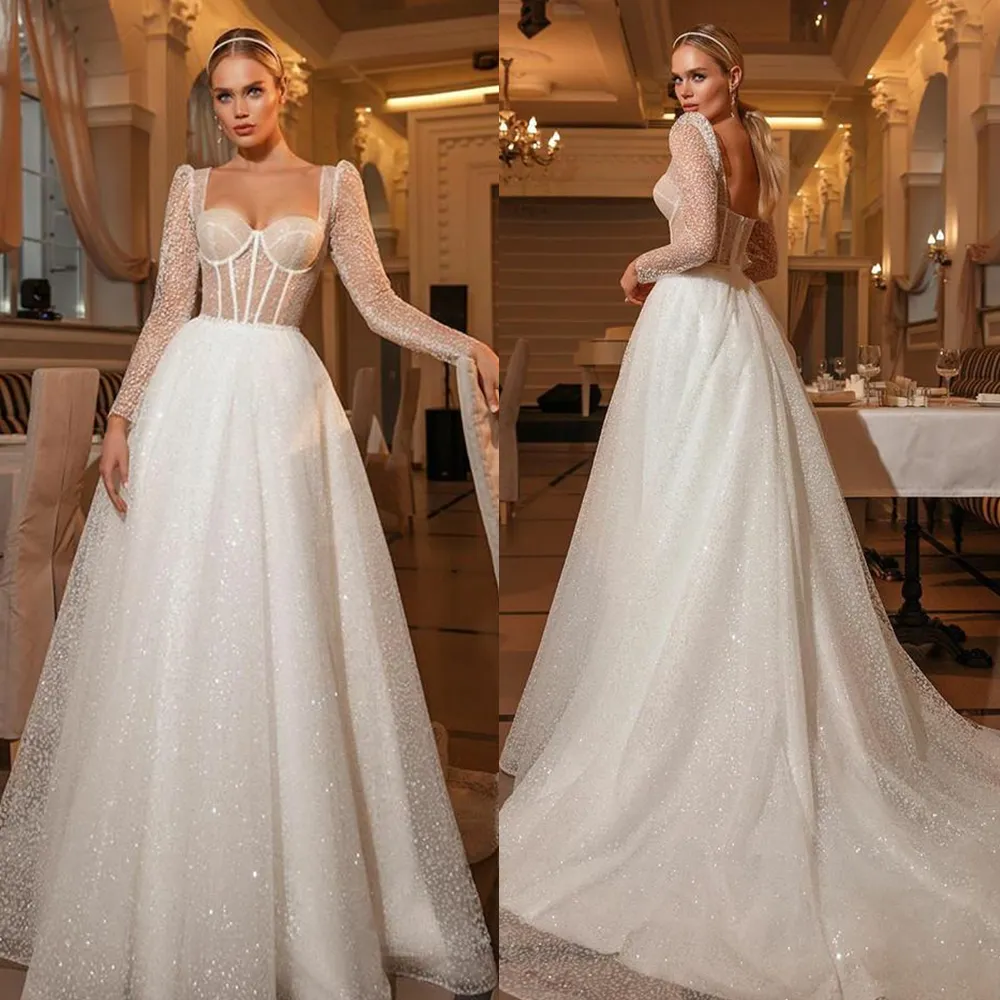 2022 Glitter White Sequined A Line Wedding Dress Long Sleeve Poots Sweetheart Corset Bridal Glows Sexig öppen ryggengagemang Klänningar Court Train Custom