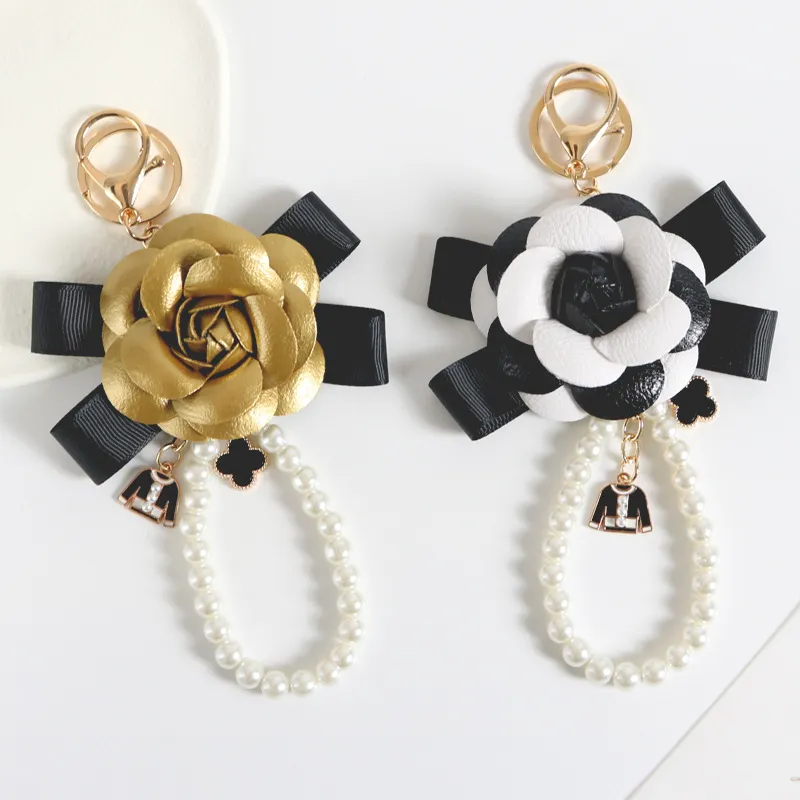 Varumärke Keyring Black Camellia Pu Leather Flower Clover Key Chains Holder Gold Metal Imitation Pearl Armband Car Keychain Ring Pendant Bag Charm smycken Tillbehör