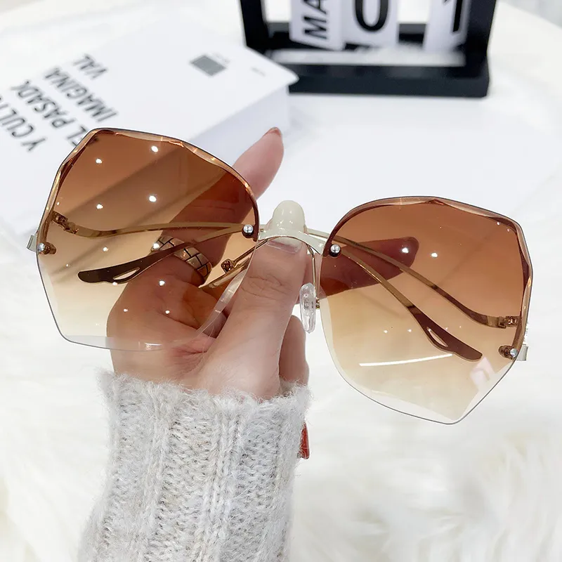 Nowa moda krawędzi kobiet bezramkowe okulary przeciwsłoneczne UV400