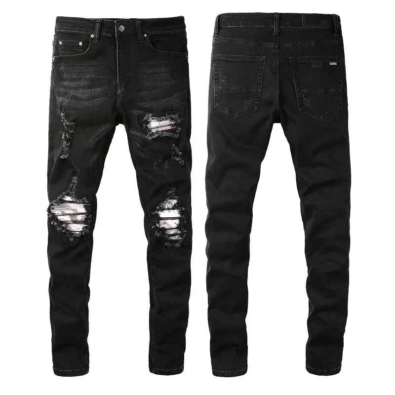 Black denim pants with distressed accents and zippers
