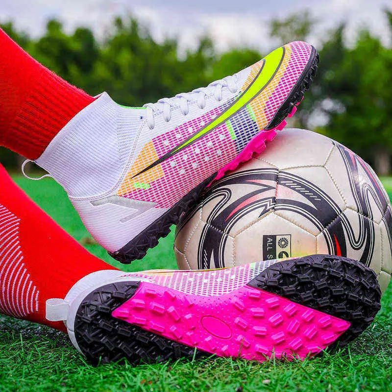 Bright pink soccer cleats top