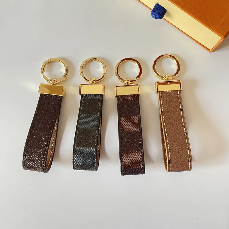 Porte-clés de luxe classique Designer voiture porte-clés en alliage de Zinc lettre unisexe lanière or noir métal bijoux amant porte-clés pendentif