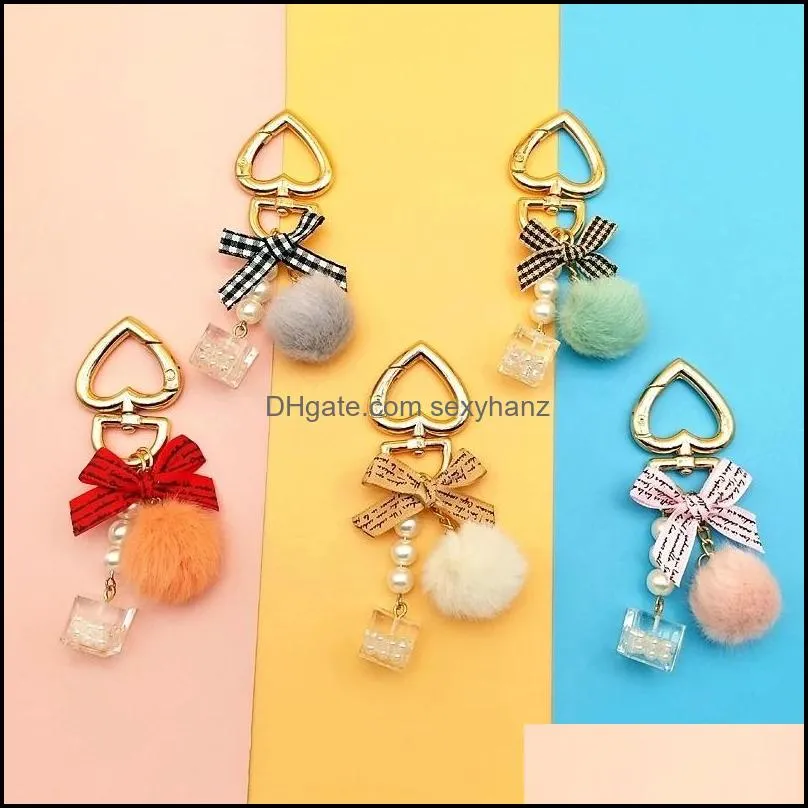 Key Rings sieraden mode parel ketting kristallen fles boog pompom sleutelhanger voor dames handtas ring auto pluizige puff ball sleutelhangers druppel levering