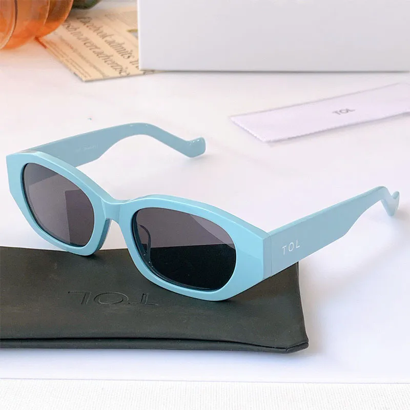 Popularne Modna Marka TCL T-5 Projektant Małe Okulary przeciwsłoneczne Kobiety Zakupy Catwalk Oval Ramki Occhiali Blue Eyewear Mężczyźni Odcienie Alfabet Drukuj Okulary przeciwsłoneczne